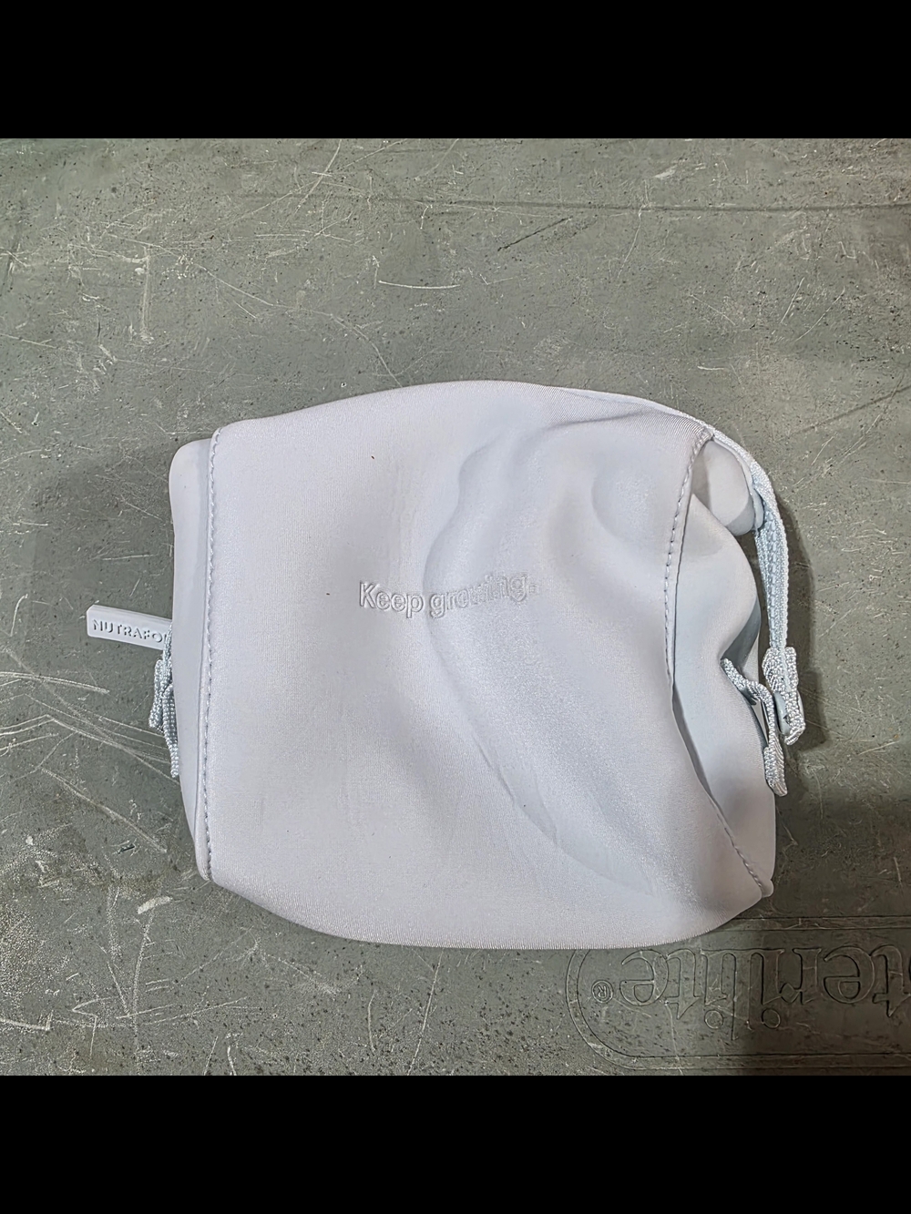 White Drawstring Pouch - "Keep growing" Embossed By Nutrafol